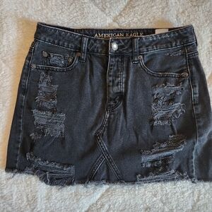 American Eagle Outfitters distressed black denim mini skirt Size 4 Button Fly